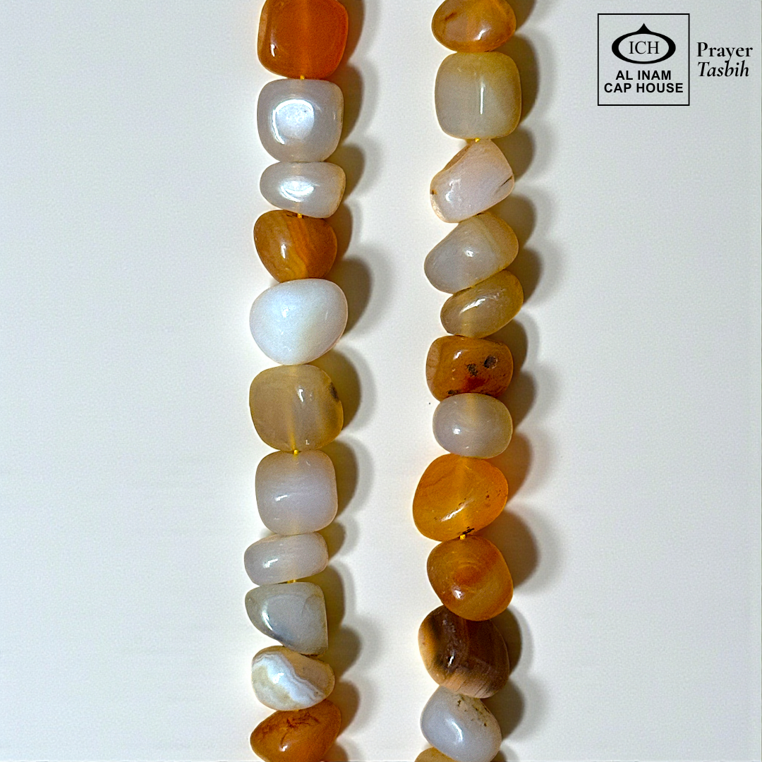 Close-up detail of AL INAM AQEEQ Tasbih highlighting natural agate stone patterns, glossy polished finish and premium craftsmanship Islamic dhikr beads design.