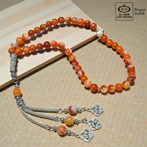 Full tasbih angle of AL INAM AQEEQ Belgium Crystal Tasbih showcasing smooth glossy beads, traditional Islamic prayer bead design and lightweight comfortable grip for zikr and meditation.