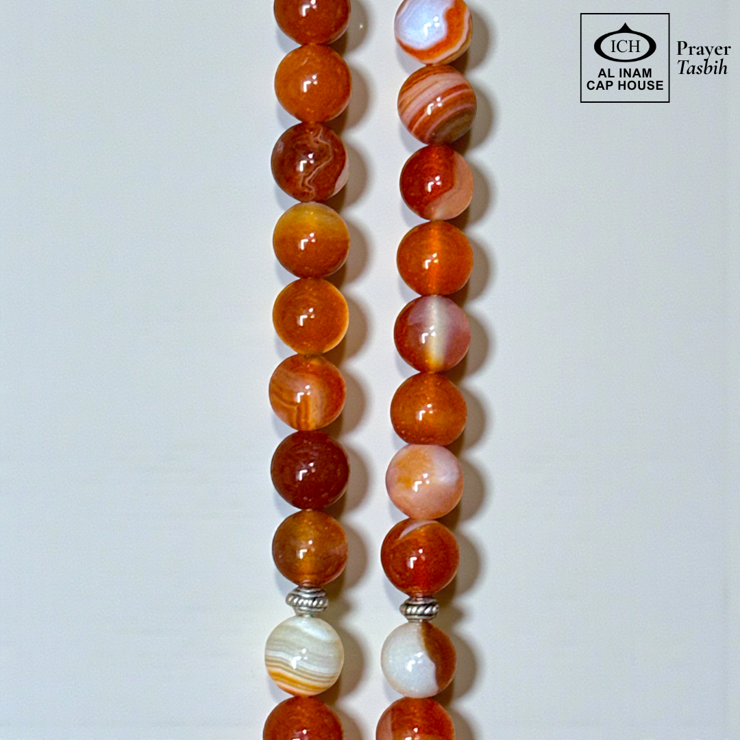 Close-up bead view of AL INAM AQEEQ Tasbih highlighting polished Belgium crystal craftsmanship, glossy finish, natural stone texture and premium Islamic dhikr beads design.