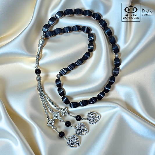 Main display view of AL INAM Black Aqeeq Tasbih ICH-0000-T18 handcrafted with genuine black aqeeq stones featuring deep polished black beads, premium Islamic prayer tasbih for dhikr, duas, Ramadan, Hajj, Umrah and daily spiritual use.