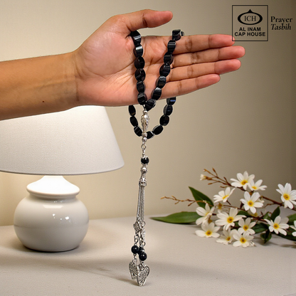 Spiritual use view of AL INAM Black Aqeeq Tasbih crafted with genuine agate beads, stylish Islamic zikr accessory ideal for Ramadan gifting, Eid, Hajj, Umrah and spiritual gatherings.