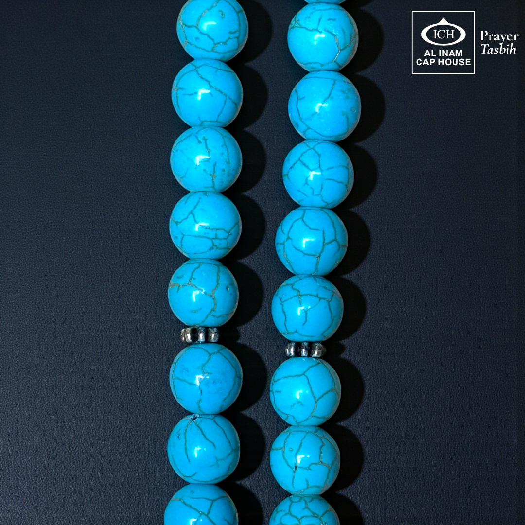 Close-up detail of AL INAM Firoza Tasbih highlighting natural turquoise stone textures, glossy polished finish and premium Islamic dhikr beads craftsmanship with unique blue veined patterns.