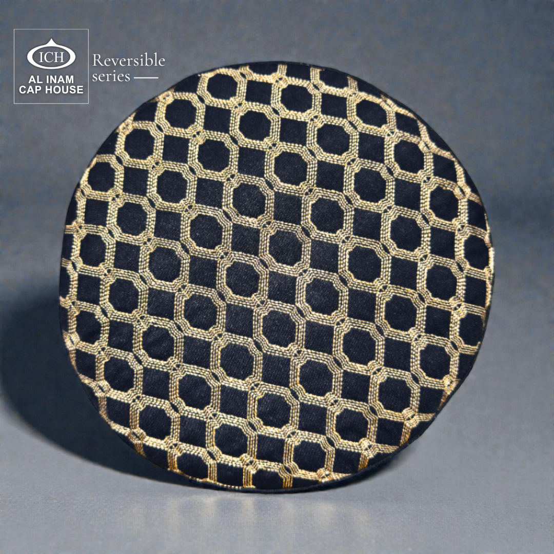 Top angle view of AL INAM ICH Reversible Islamic Skull Cap in black and gold featuring fine stitching, symmetrical pattern, soft cotton construction and premium craftsmanship for long prayer sessions.