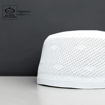 Side profile view of AL INAM White Islamic Prayer Cap showing structured fit, fine stitching and breathable cotton material for comfortable skull cap use.