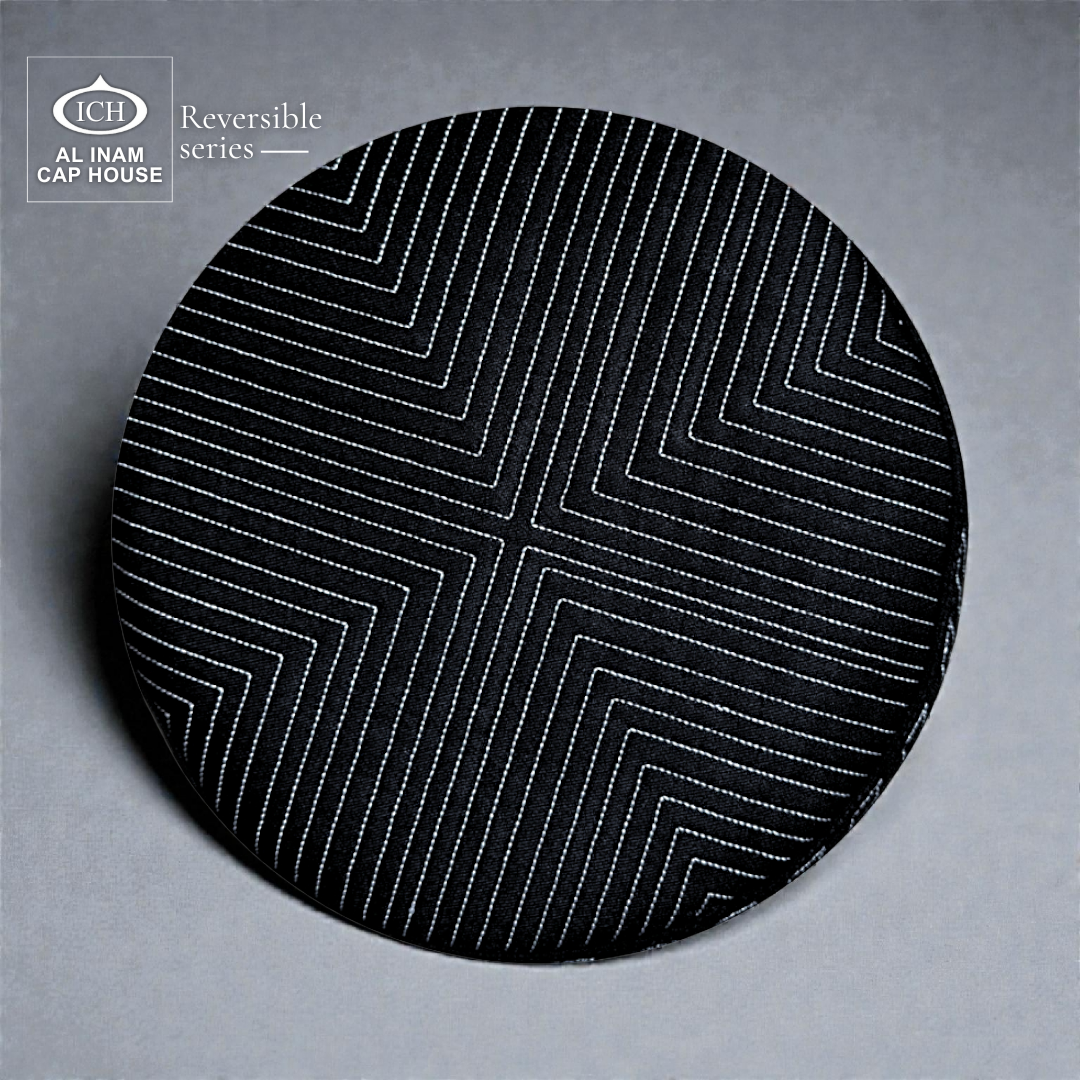 Top view of AL INAM ICH Black Reversible Islamic Prayer Cap displaying symmetrical geometric pattern design, premium craftsmanship, comfortable breathable kufi for Muslim men.