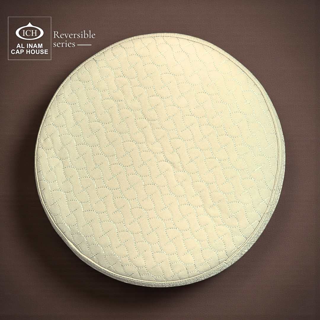 Top view of AL INAM ICH Cream Reversible Islamic Prayer Cap displaying symmetrical textured pattern, premium craftsmanship, breathable and comfortable kufi cap for Muslim men.