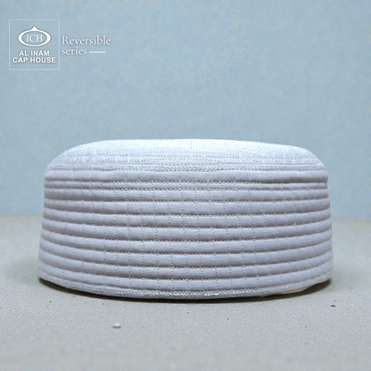 Front style view of AL INAM ICH Reversible Islamic Prayer Cap ICH-00001-A23 crafted with premium breathable cotton fabric, elegant woven detailing, lightweight and comfortable kufi skull cap for Muslim men, perfect for namaz, Friday prayer, Eid and everyday Islamic wear.