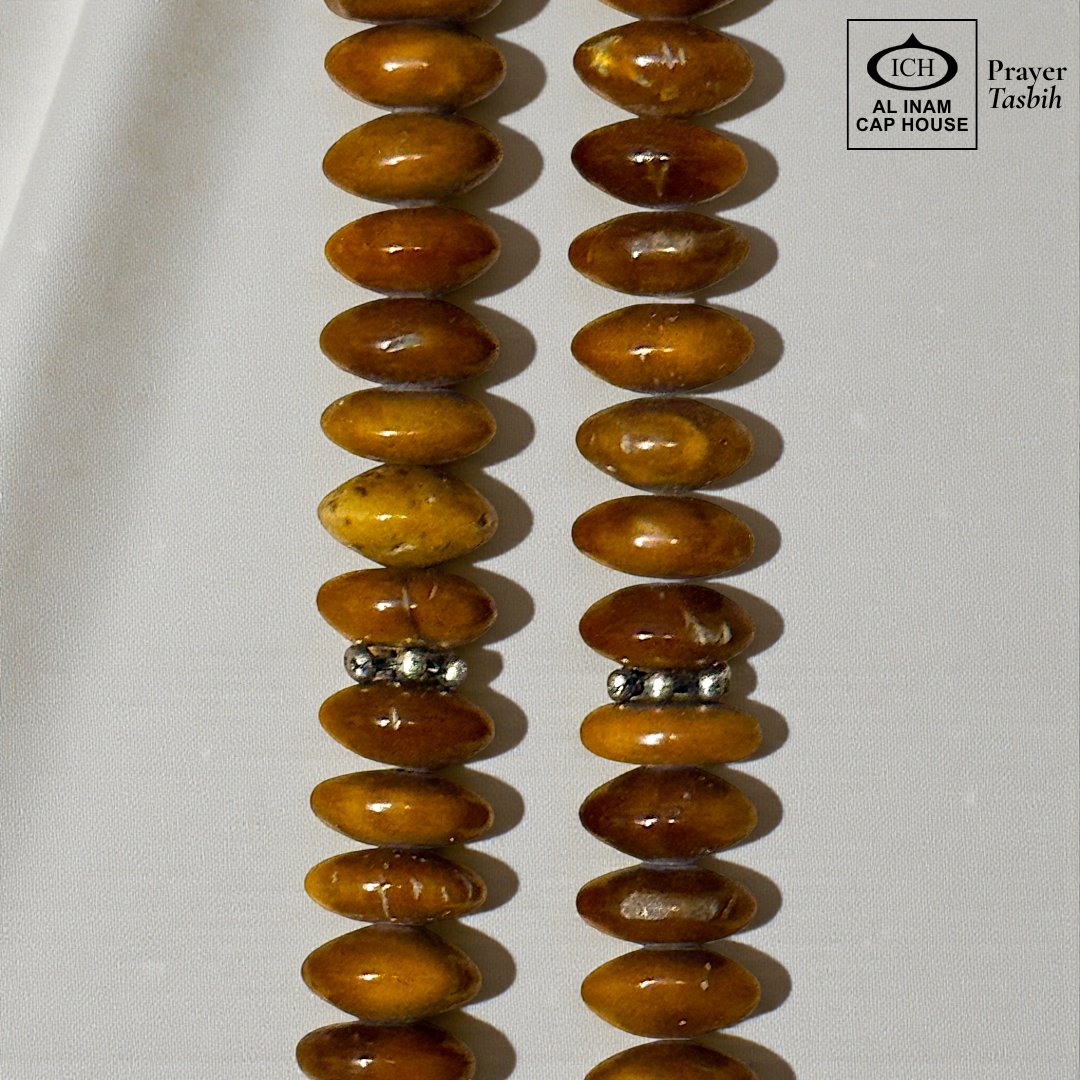 Close-up detail of AL INAM Koka Tasbih highlighting natural Kokka wood grain textures, polished handcrafted finish and premium Islamic dhikr beads craftsmanship.