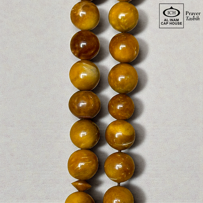 Close-up detail of AL INAM Koka Tasbih highlighting natural Kokka wood grain patterns, handcrafted polished finish and premium Islamic dhikr beads craftsmanship.