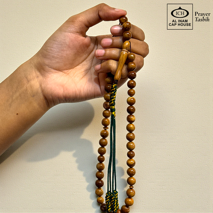 Spiritual use view of AL INAM Koka Tasbih crafted with authentic Kokka wood beads imported from Turkey, elegant Islamic zikr accessory ideal for Ramadan gifting, Eid, Hajj, Umrah and spiritual gatherings.