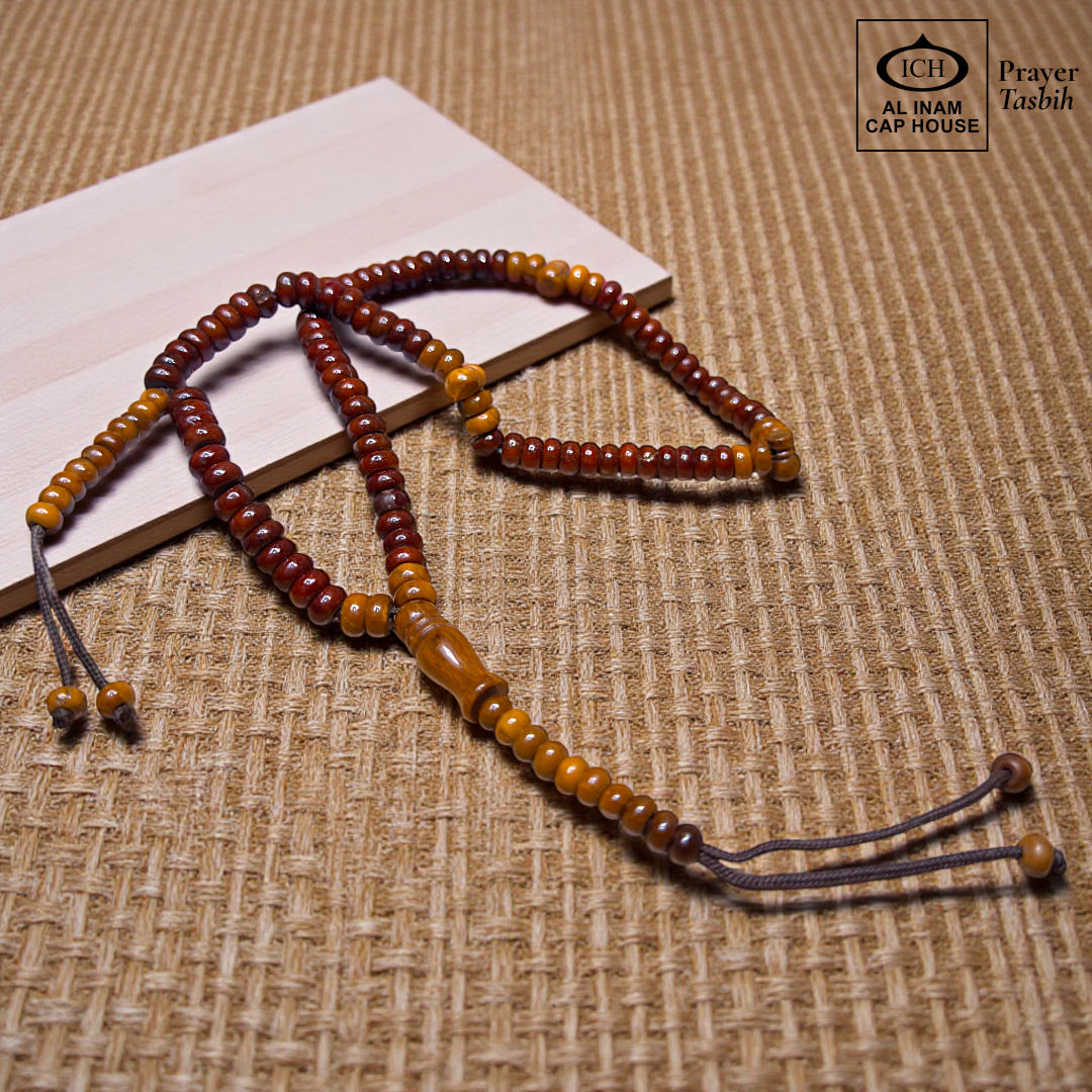 Main display view of AL INAM Koka Tasbih ICH-0000-T12 handcrafted with authentic Kokka wood beads featuring warm natural wooden tones and grain textures, premium Islamic prayer beads for dhikr, duas, Ramadan, Hajj, Umrah and daily spiritual use.