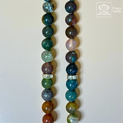 Close-up detail of AL INAM Sulemani Aqeeq Tasbih highlighting natural agate stone banded patterns, glossy polished finish and premium craftsmanship Islamic dhikr beads design.