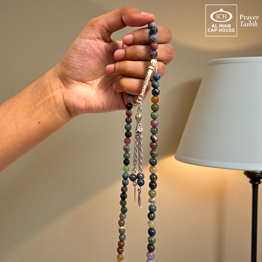 Spiritual use view of AL INAM Sulemani Aqeeq Tasbih crafted with genuine agate beads and silver toned Islamic tassel, elegant zikr accessory ideal for Ramadan gifting, Eid, Hajj, Umrah and spiritual gatherings.