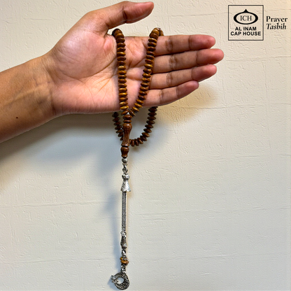 Handheld angle view of AL INAM Koka Islamic Prayer Tasbih showing lightweight balanced wooden bead arrangement, smooth comfortable grip and durable craftsmanship for daily tasbeeh recitation and duas.