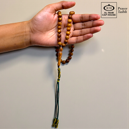 Handheld display angle of AL INAM Koka Islamic Prayer Tasbih showing lightweight balanced wooden bead arrangement, comfortable grip and durable craftsmanship for daily tasbeeh recitation and duas.