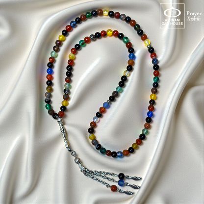 Full tasbih angle of AL INAM AQEEQ Islamic Prayer Tasbih showcasing polished agate beads, elegant silver toned tassel detailing and traditional Muslim prayer bead design for zikr and meditation.