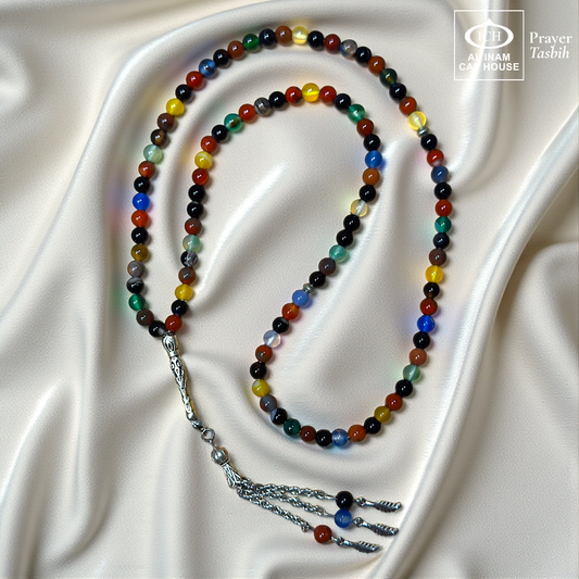 Full tasbih angle of AL INAM AQEEQ Islamic Prayer Tasbih showcasing polished agate beads, elegant silver toned tassel detailing and traditional Muslim prayer bead design for zikr and meditation.