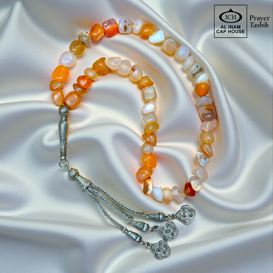 Full angle view of AL INAM AQEEQ Islamic Tasbih showcasing polished agate beads, elegant silver toned tassel detailing, traditional Muslim prayer bead design and comfortable grip for zikr and meditation.
