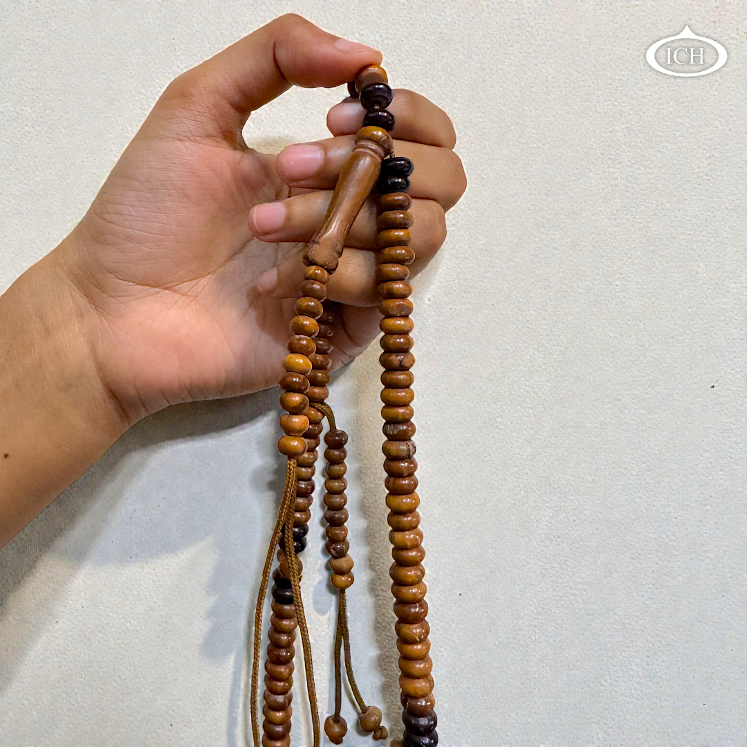 Original Kokka wood tasbih held in hand, lightweight Islamic tasbeeh ideal for daily dhikr, dua, and namaz